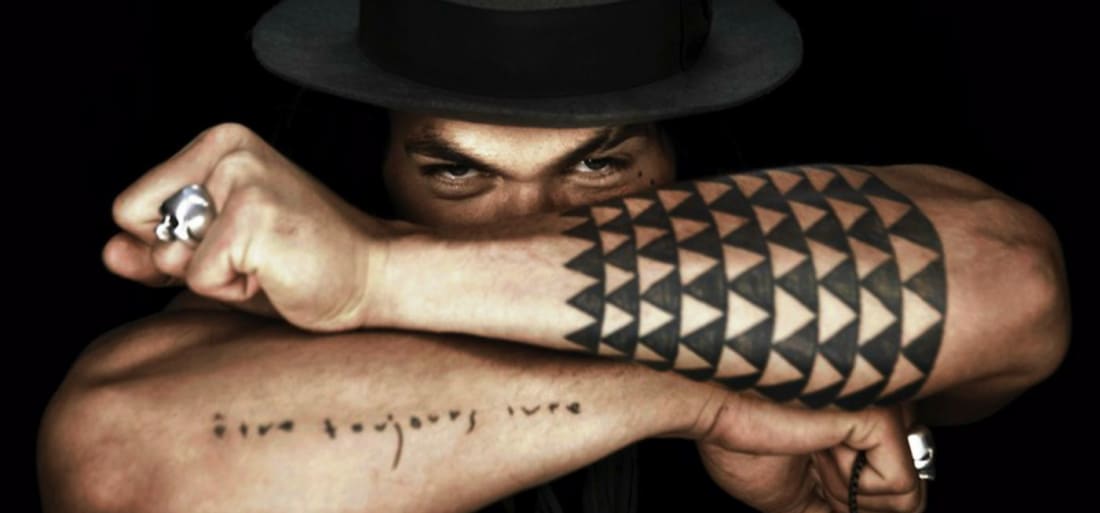 (c) YouTube The Secret Meaning Behind Jason Momoa's Forearm Tattoo Shows He Was Destined To Play Aquaman