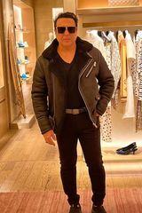 Govinda wearing a black jacket